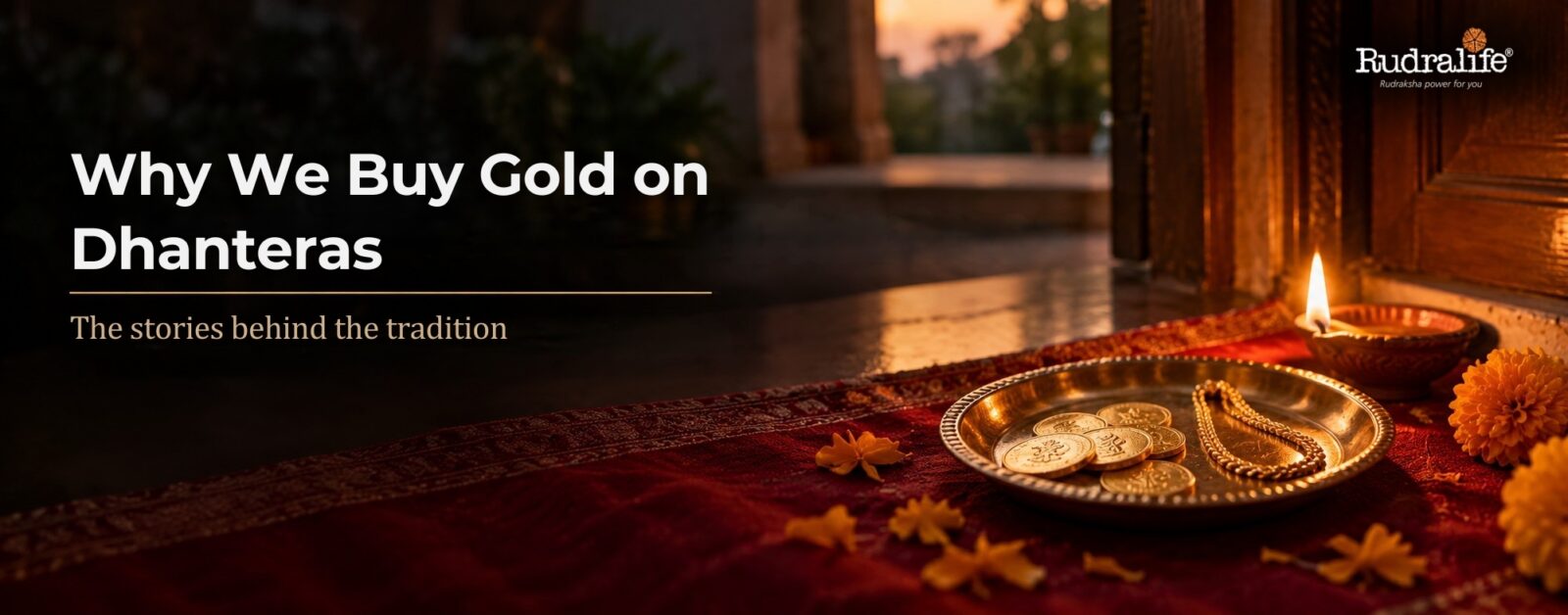 Why we buy gold on Dhanteras: gold coins & a gold chain on a brass plate beside a diya & marigolds