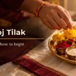 Bhai Dooj 2026 tilak thali with kumkum, akshat, a diya, marigolds, sweets, betel leaf & dry fruits