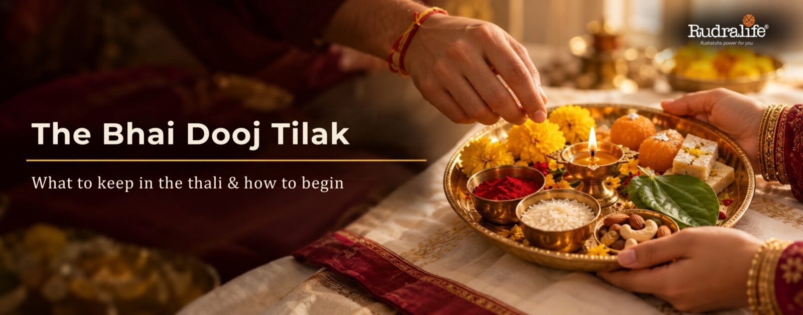 Bhai Dooj 2026 tilak thali with kumkum, akshat, a diya, marigolds, sweets, betel leaf & dry fruits