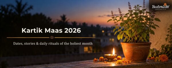 Diya lit beside a tulsi plant at dusk during Kartik maas 2026