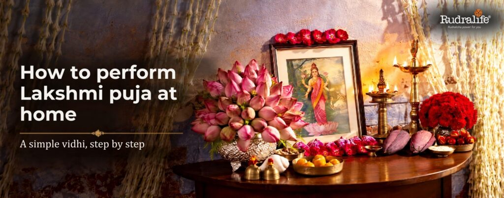 Home altar set for Lakshmi Puja 2026 with lotus, diyas and offerings