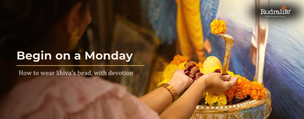 Devotee offering a Rudraksha mala at a Shivling on a Monday, before wearing 4 Mukhi Rudraksha with devotion